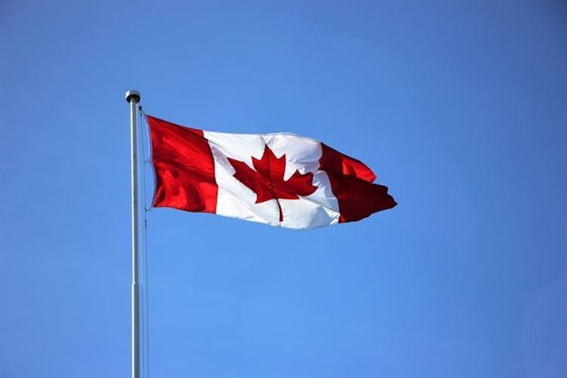 Canadian flag on a pole.