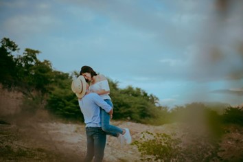 A man lifting a woman